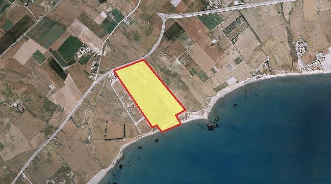 Huge beach-front land for sale in Softades.