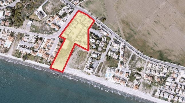 Land on the beach with hotel apartment in Pervolia.