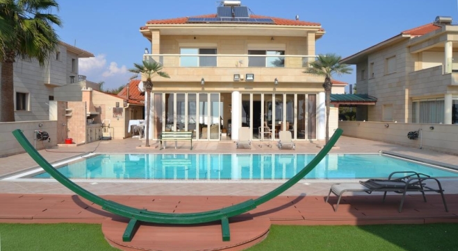 Luxury beach front villa for sale in Pervolia with sea views.