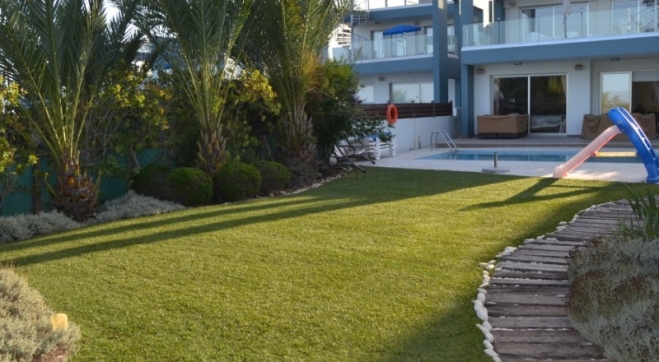 Luxury ground floor sea front apartment for sale in Pervolia